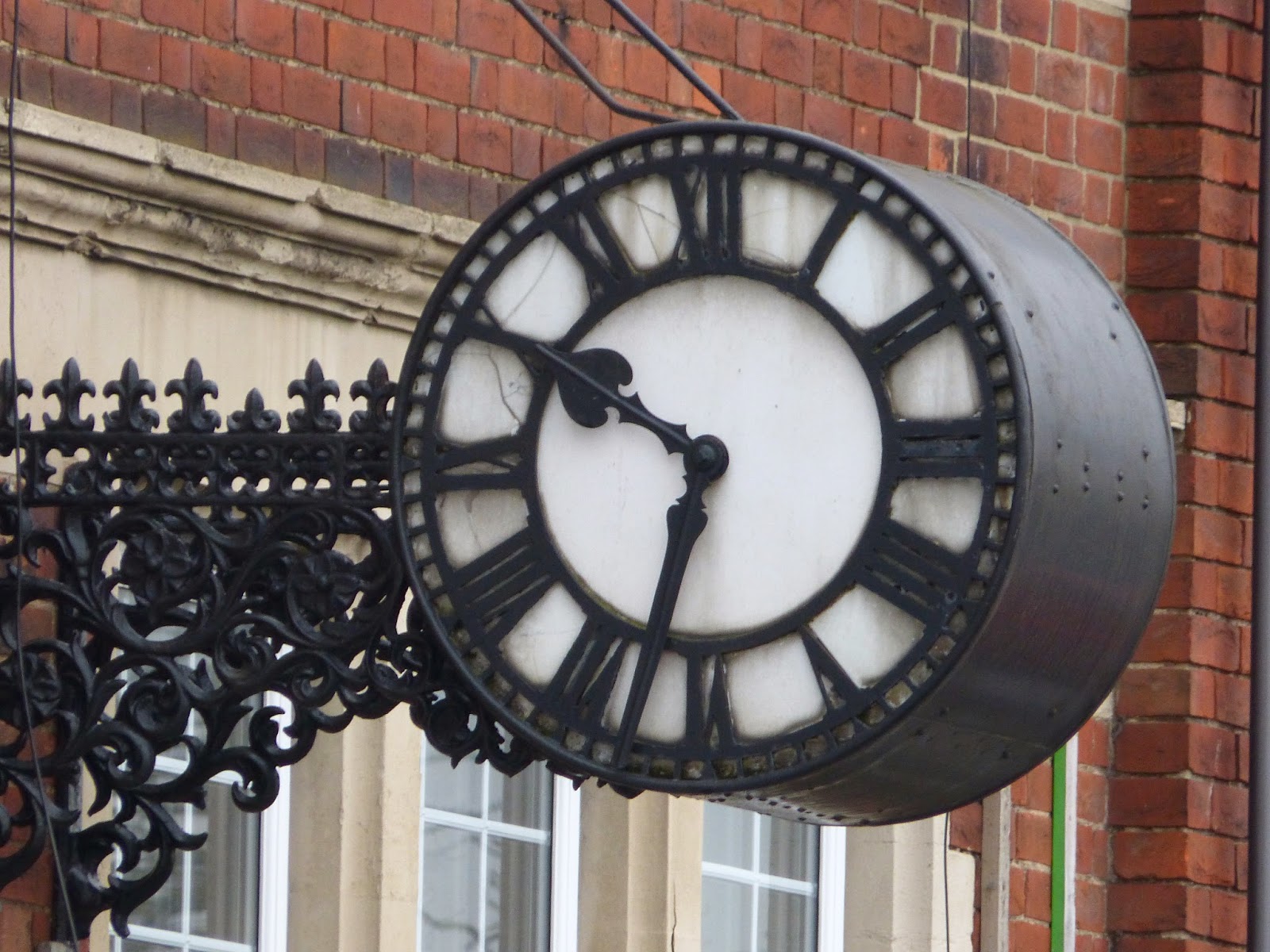 Broad Street Teddington J.Coutts Clock — stopped public clock