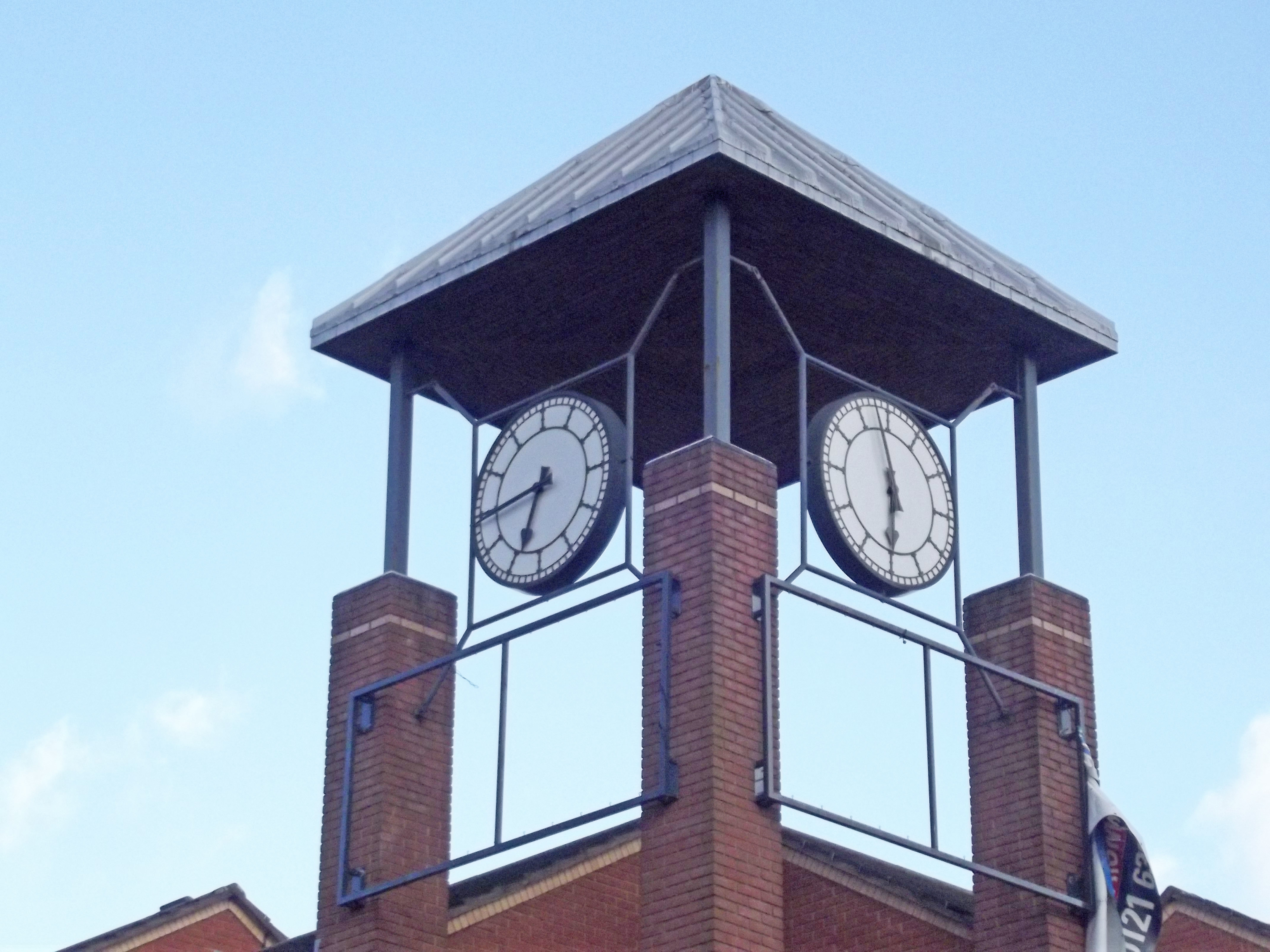 Clock tower at Queen's Hospital Close Birmingham Student Accommodation — stopped public clock